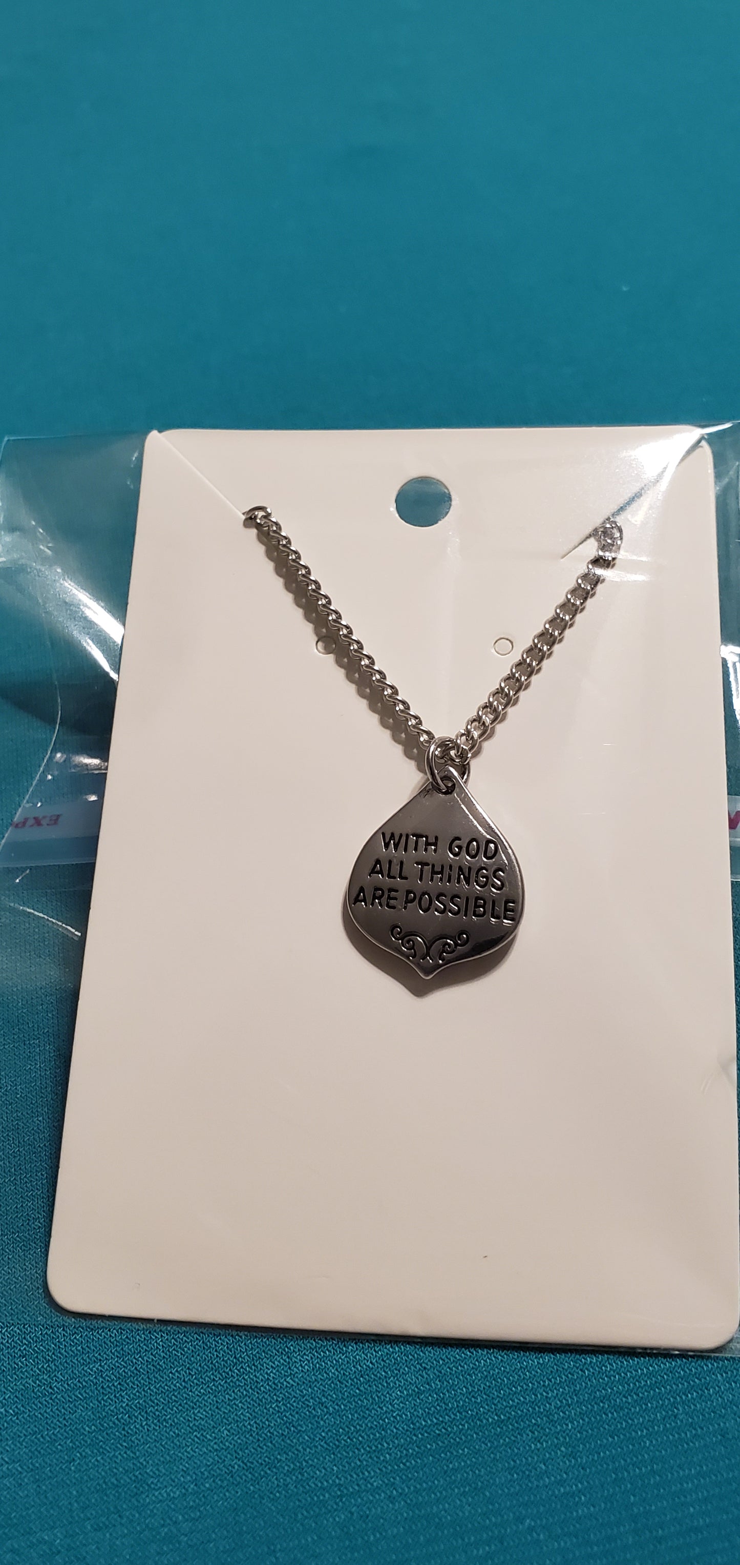 With god all things are possible charm on gold plated necklace